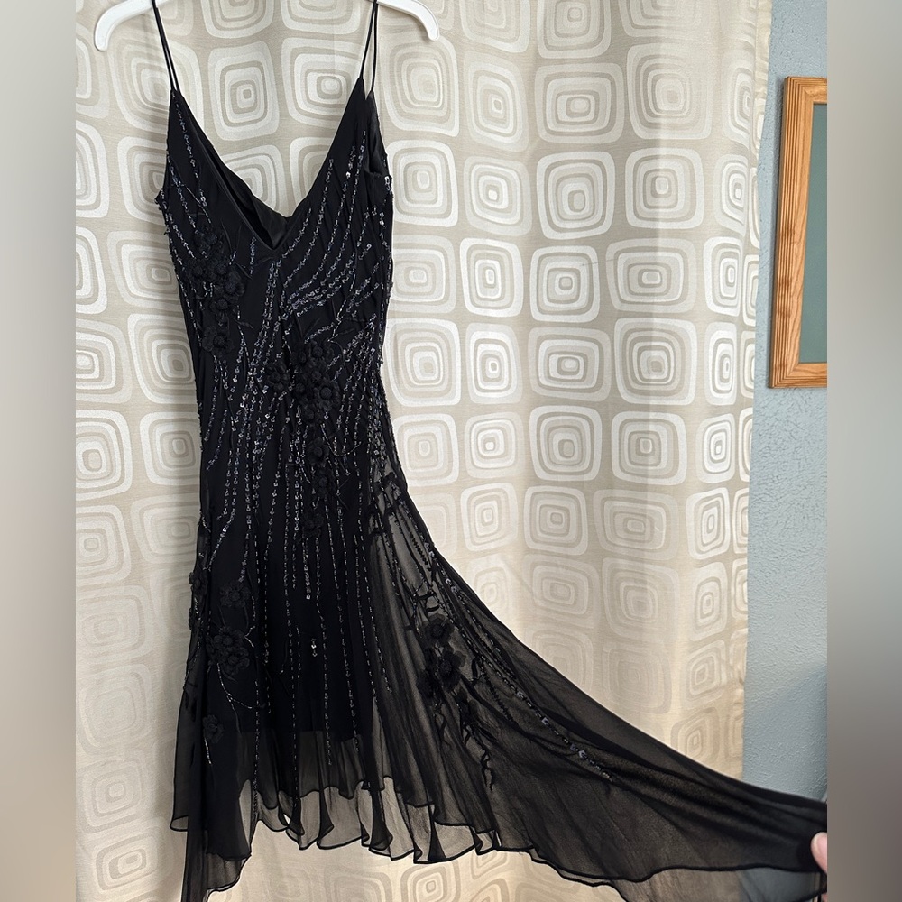 Black embroidered and sequined dress with asymmetrical hem